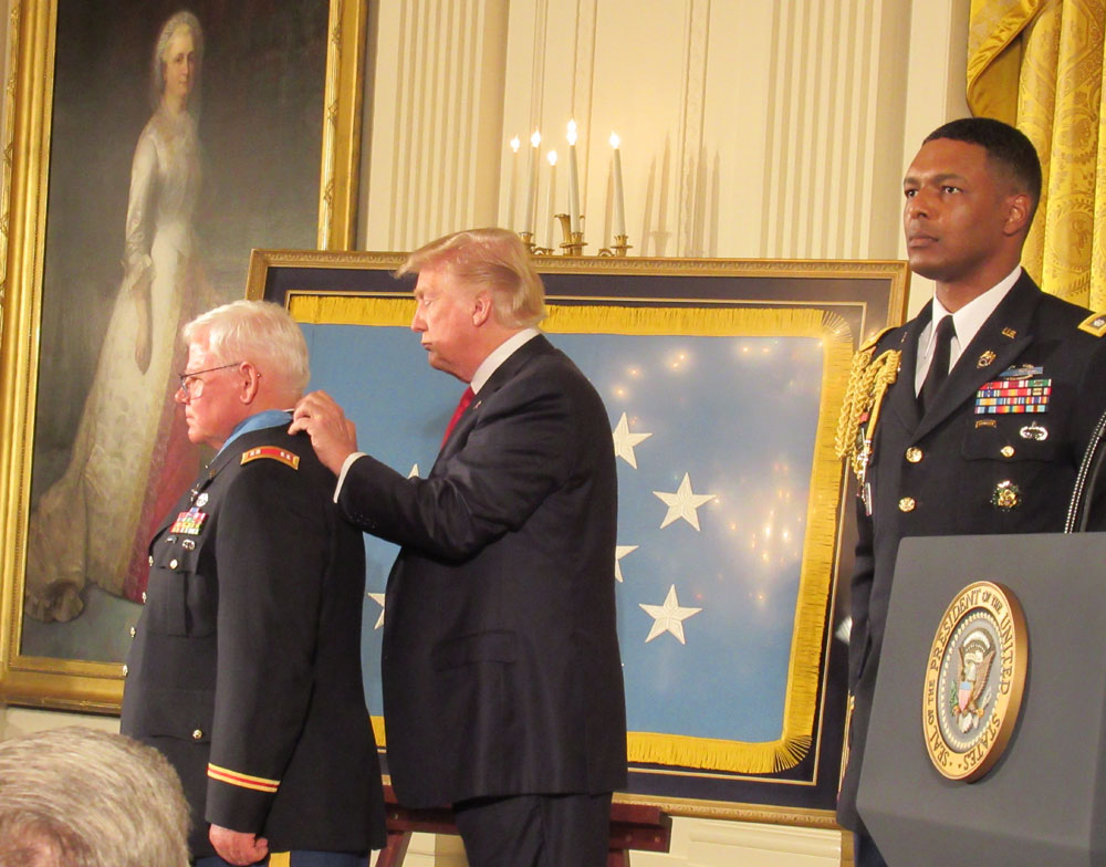 President Trump about to present the Medal of Honor to Captain Gary M. Rose, USA (ret), in the White House East Room. Mike was a 22-year old sergeant in 1970, when he earned the Medal. (Photo by Gail Plaster)